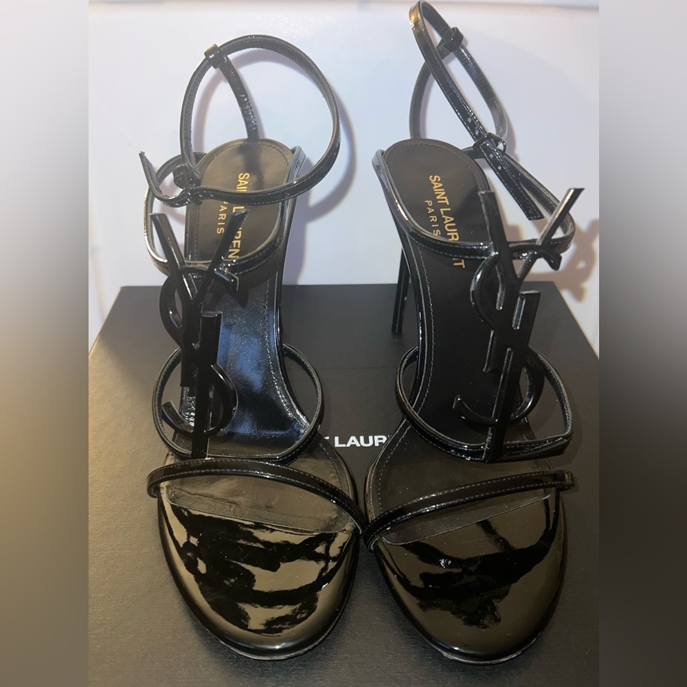 SAINT LAURENT
Cassandra logo-embellished patent-leather sandals